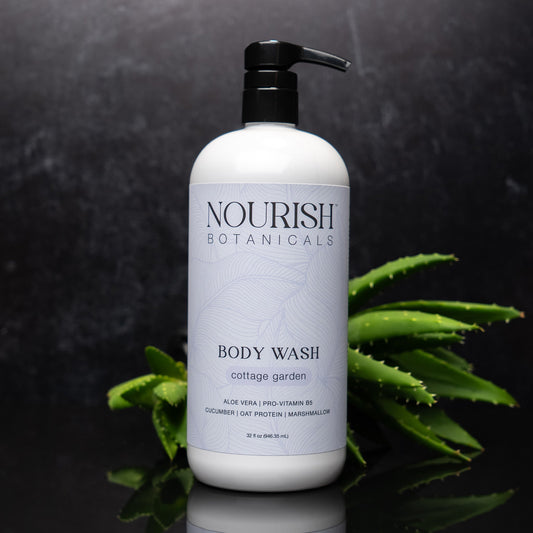 Rustic Strength Aloe Vera Body Wash in a 32oz bottle with a Cottage Garden label, showing a clear gel and botanical design.
