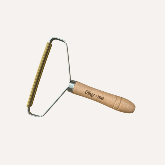 Reusable Tilley + Me pet hair lint remover made from eco-friendly beech wood, ideal for grooming dogs and removing pet fur.