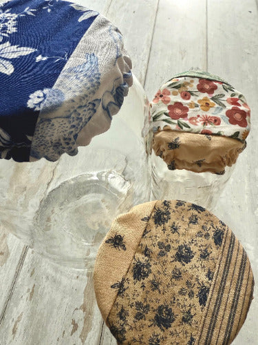 Farm-style jar covers by Five Oaks Farm, featuring rustic design and secure fit for preserving jars.