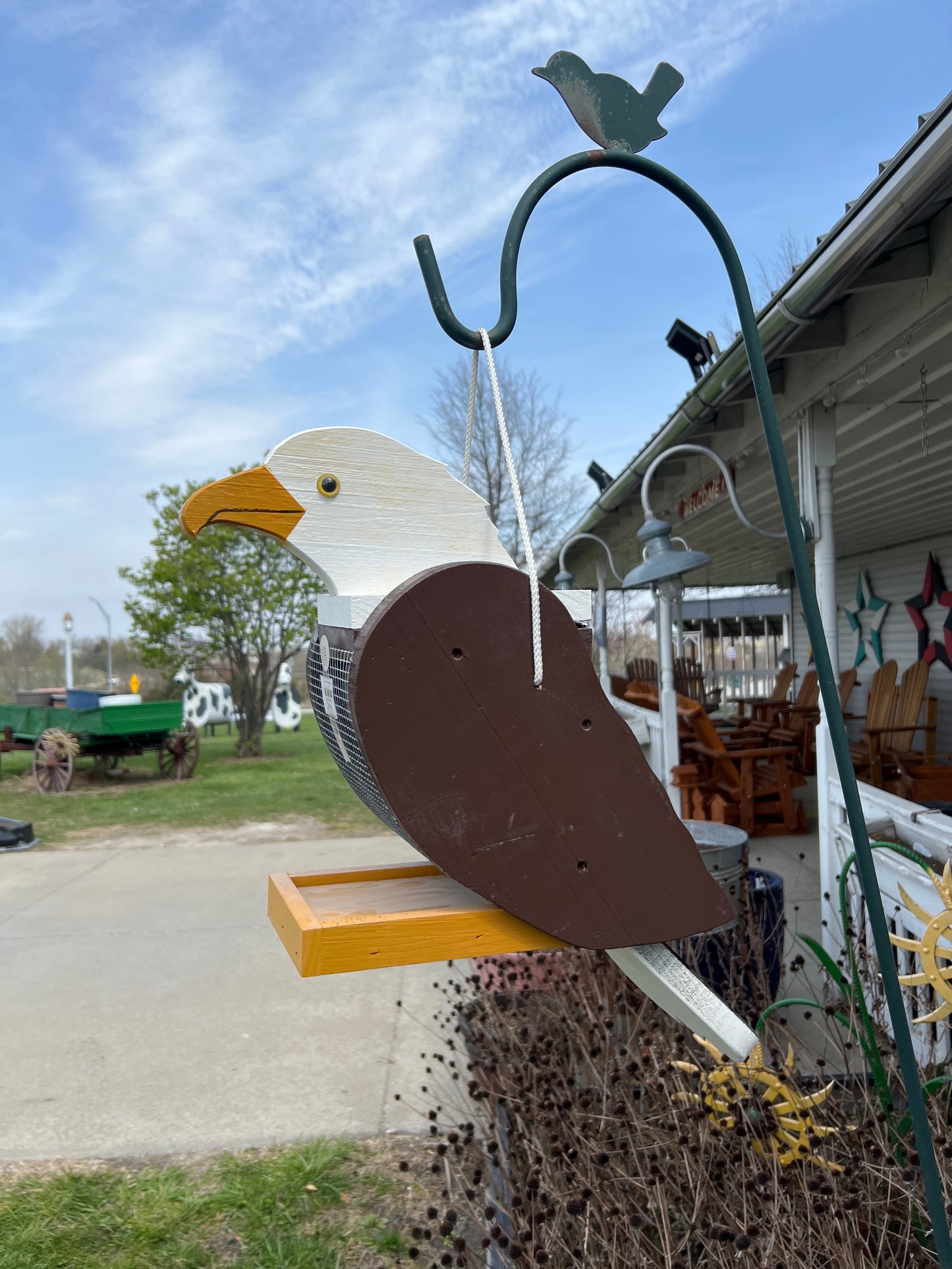 Amish-made wooden bird-shaped feeder for garden decor, handcrafted by Amish Country Store, available in multiple styles.