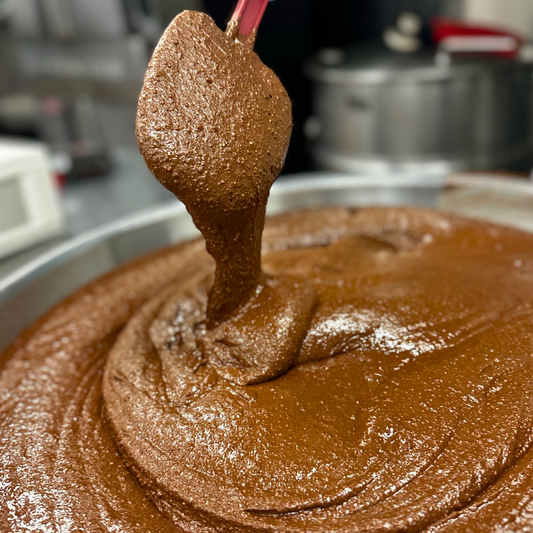 Creamy cacao cashew spread from Mixed Up Foods in an 8 oz jar, showcasing the smooth, rich nut butter texture.