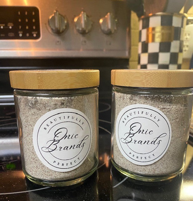 Onic Brands LLC cappuccino drink mix in a jar with a scoop, ready to prepare a creamy coffee beverage.