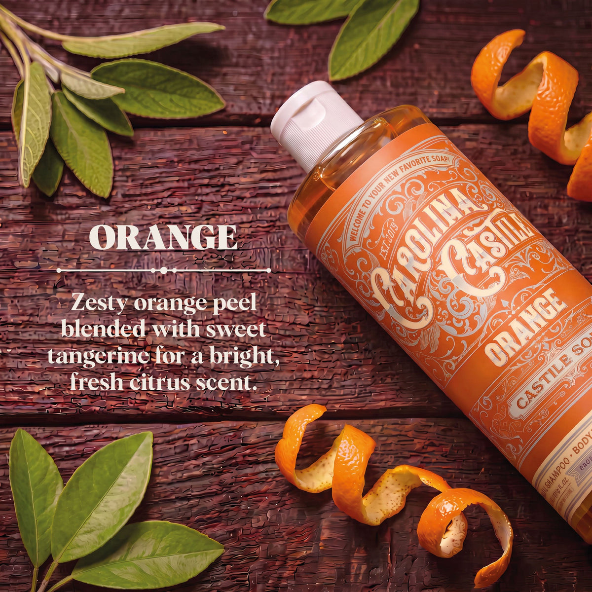 Orange Carolina Castile Soap in a clear bottle with a pump dispenser, showcasing vibrant orange liquid and brand label.
