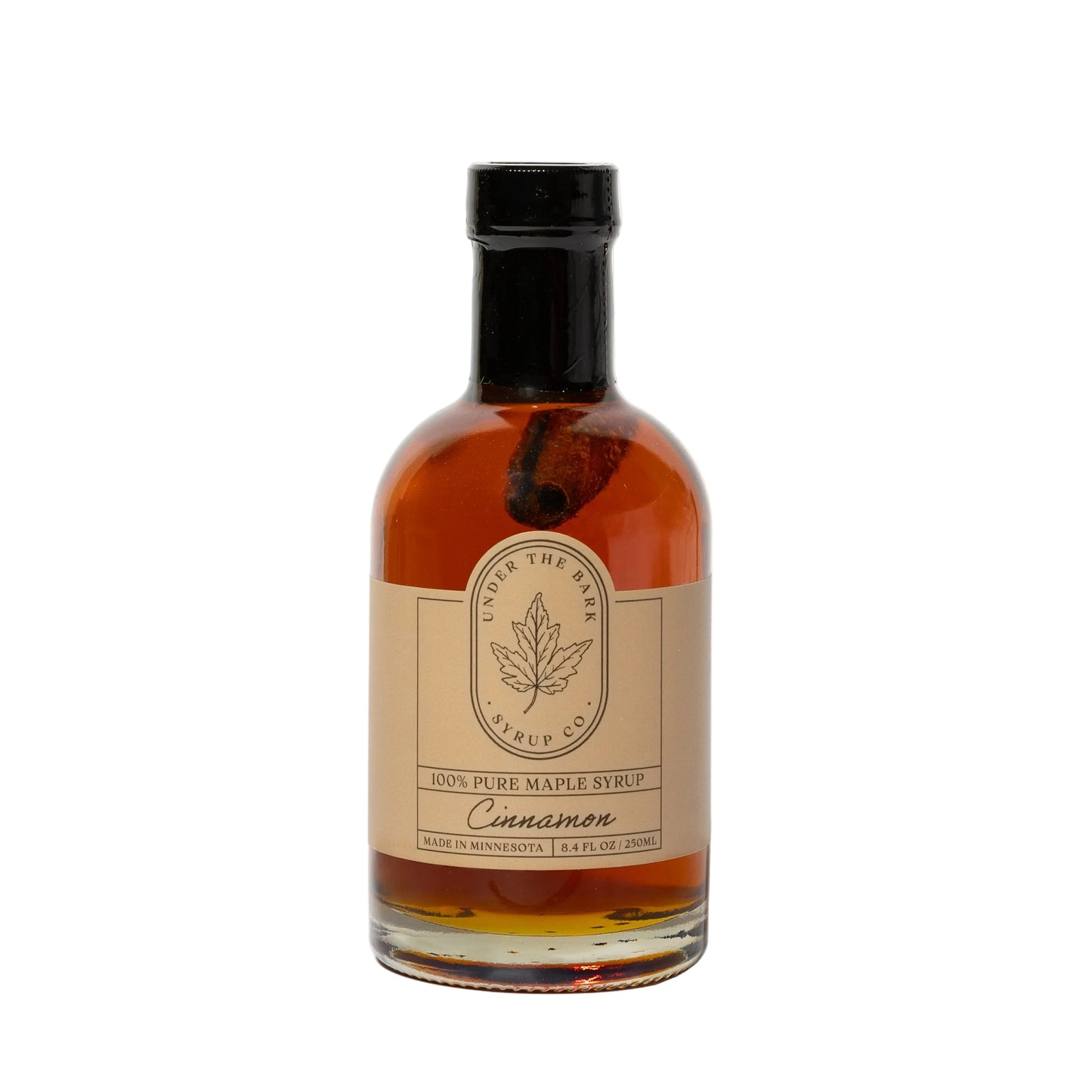 8oz bottle of cinnamon maple syrup from Under The Bark Syrup Co, showing rich syrup with cinnamon and maple flavor details.