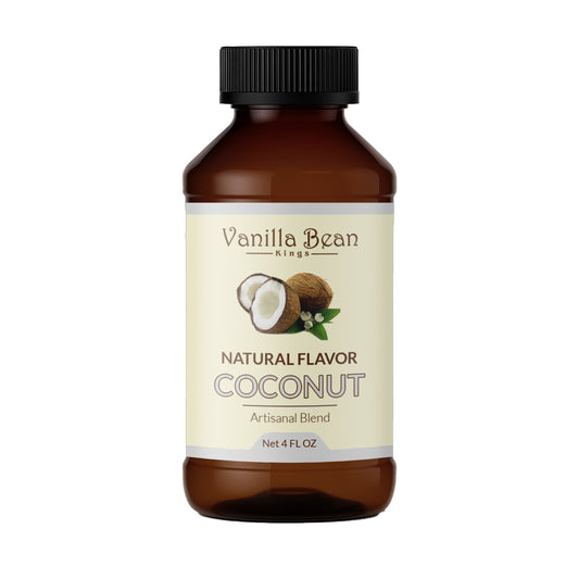 Fresh natural coconut extract from Vanilla Bean Kings shown in a clear glass jar with coconut pieces and extract visible.