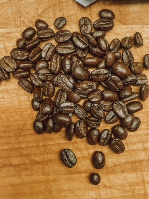 Dark roasted Nicaraguan coffee beans from Onic Brands LLC, showcasing rich, aromatic coffee beans for brewing.