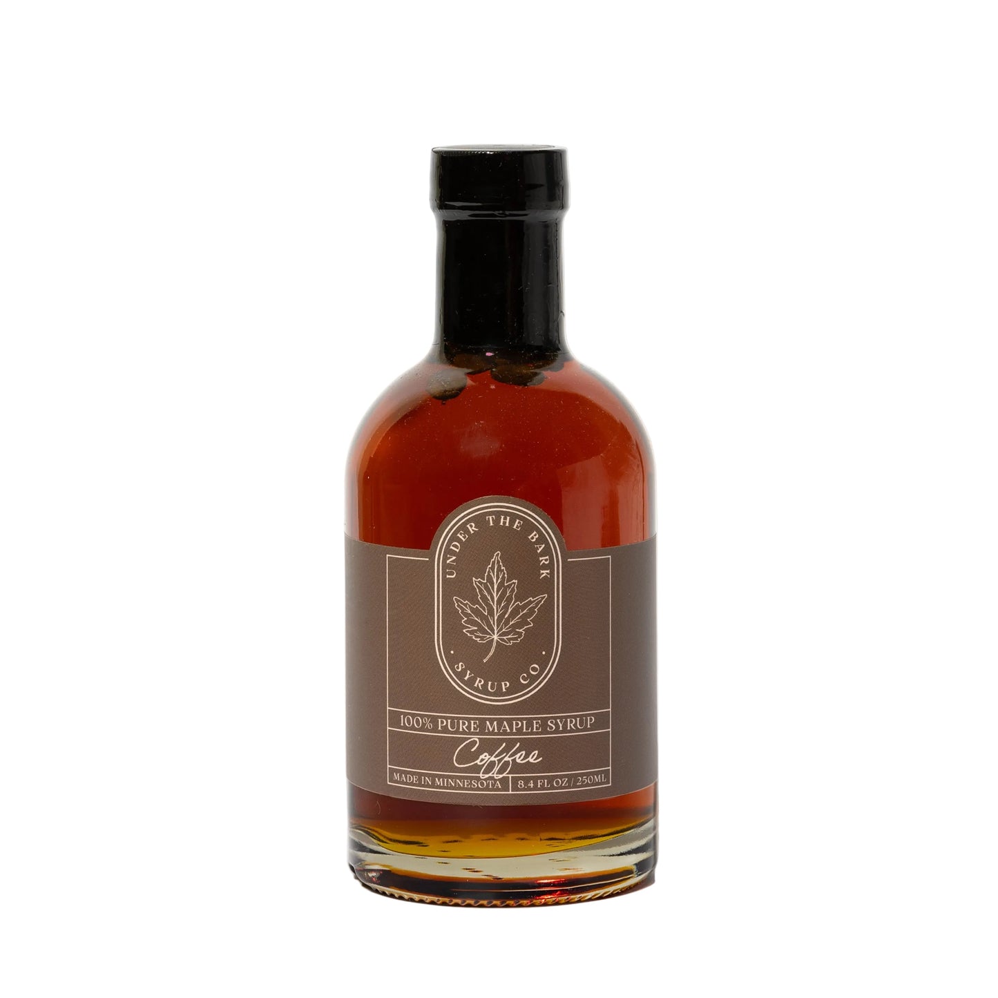 8 oz bottle of Coffee Maple Syrup by Under The Bark Syrup Co, showing the dark, rich syrup in a glass jar.