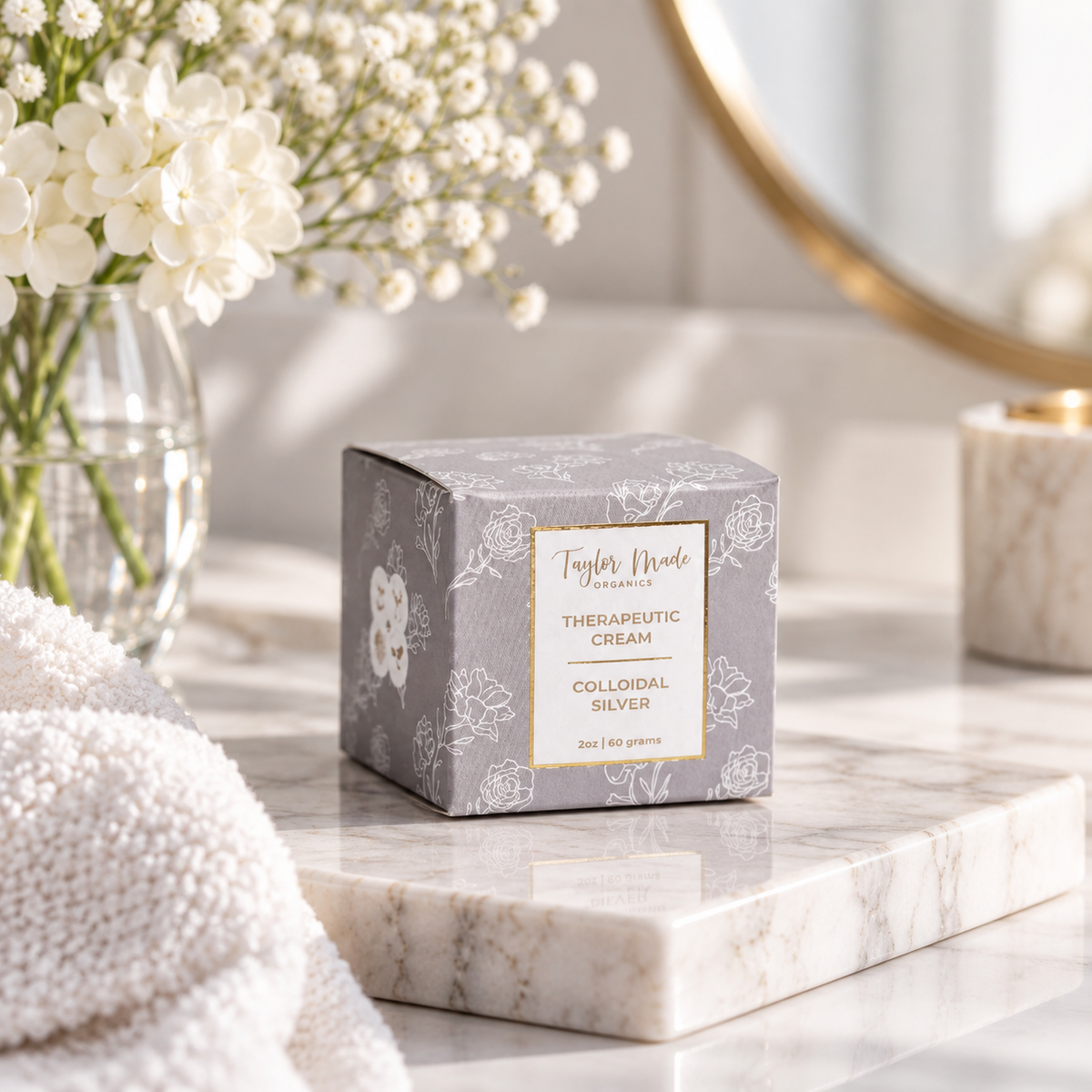 Box of Taylor Made Organics colloidal silver organic therapeutic cream, featuring natural ingredients and product branding.
