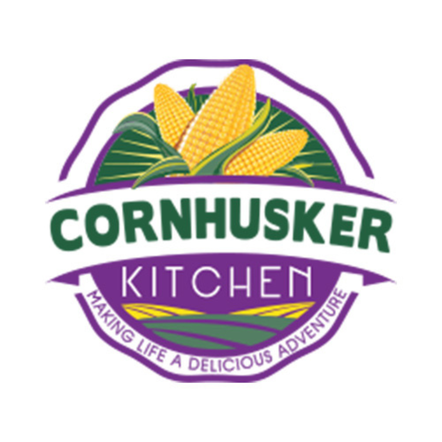 Rendered duck fat in a 1.5 lb jar from Cornhusker Kitchen, gluten-free and non-GMO, displayed on a kitchen countertop.