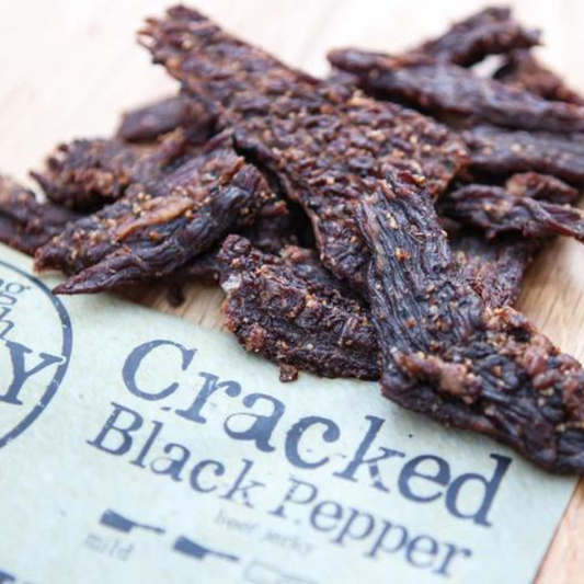 Cracked black pepper beef jerky in a 2.5 oz package by BuyNebraska.com, showing spicy, seasoned dried beef slices.