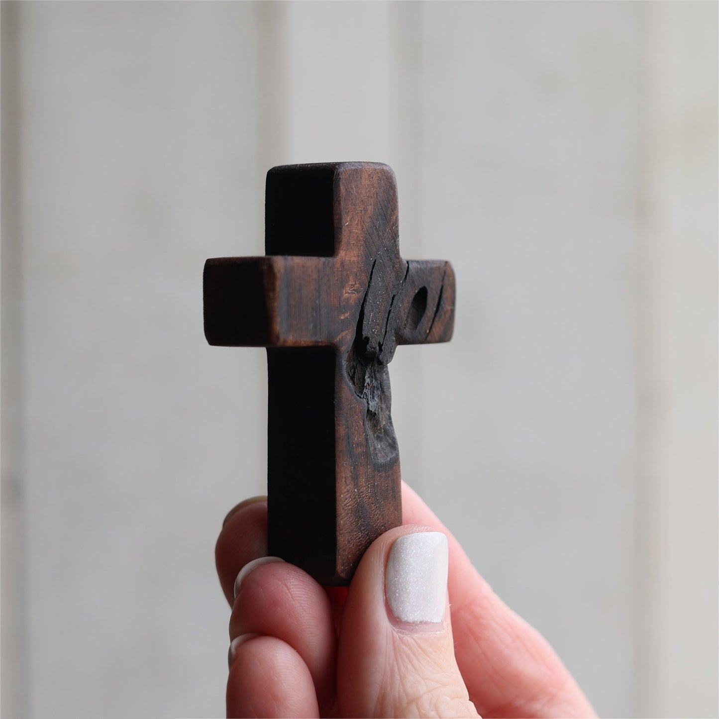 Wooden cross necklace from Dennehey Design Co., featuring a rugged pocket-style design with detailed craftsmanship.