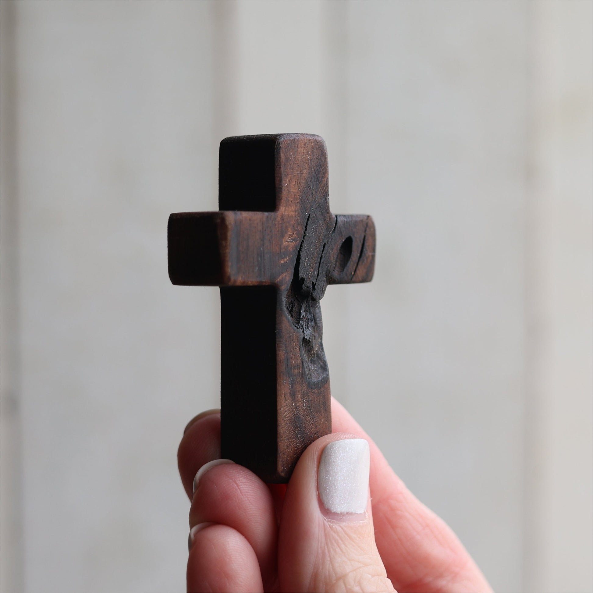 Wooden cross necklace from Dennehey Design Co., featuring a rugged pocket-style design with detailed craftsmanship.