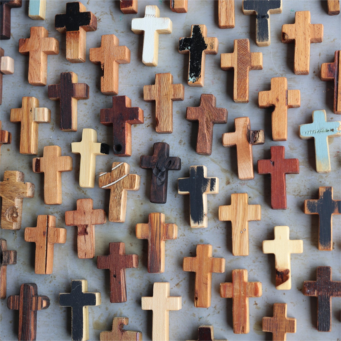 Wooden cross necklace from Dennehey Design Co. featuring a rugged pocket-style design with natural wood grain and detailed craftsmanship.