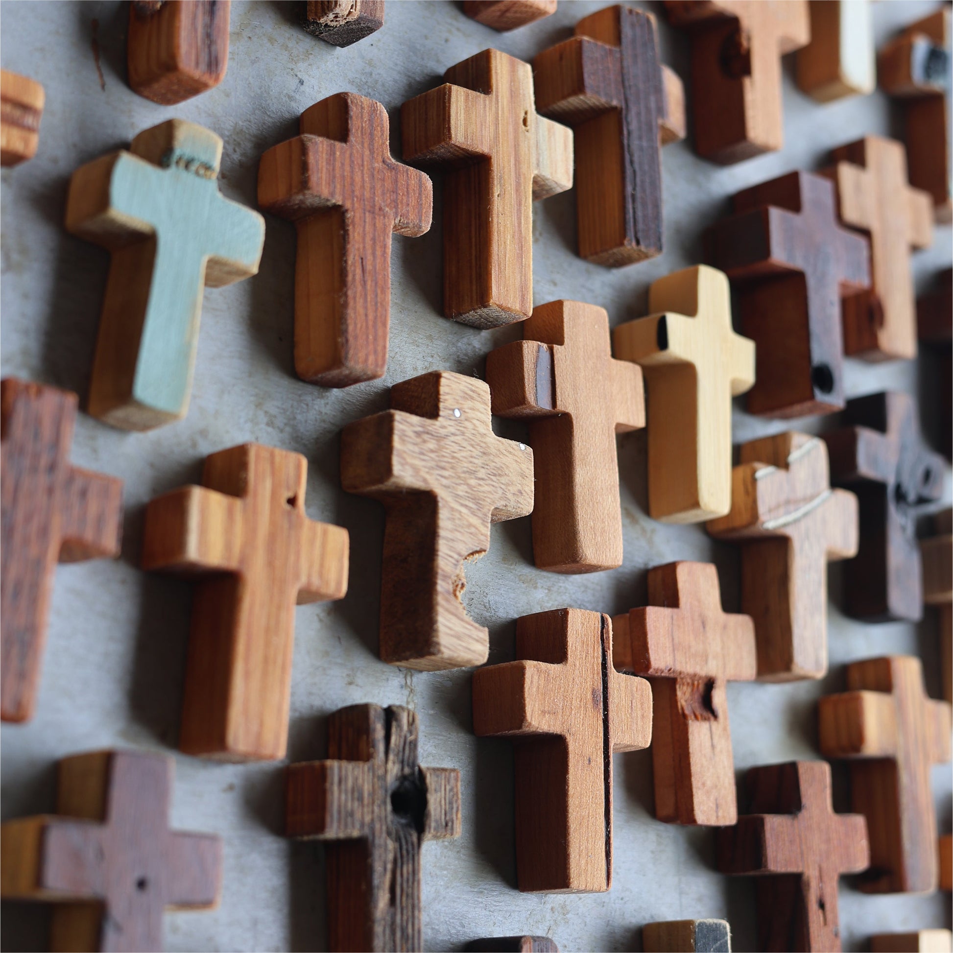 Wooden Cross necklace from Dennehey Design Co. featuring a rugged pocket cross design with detailed craftsmanship.