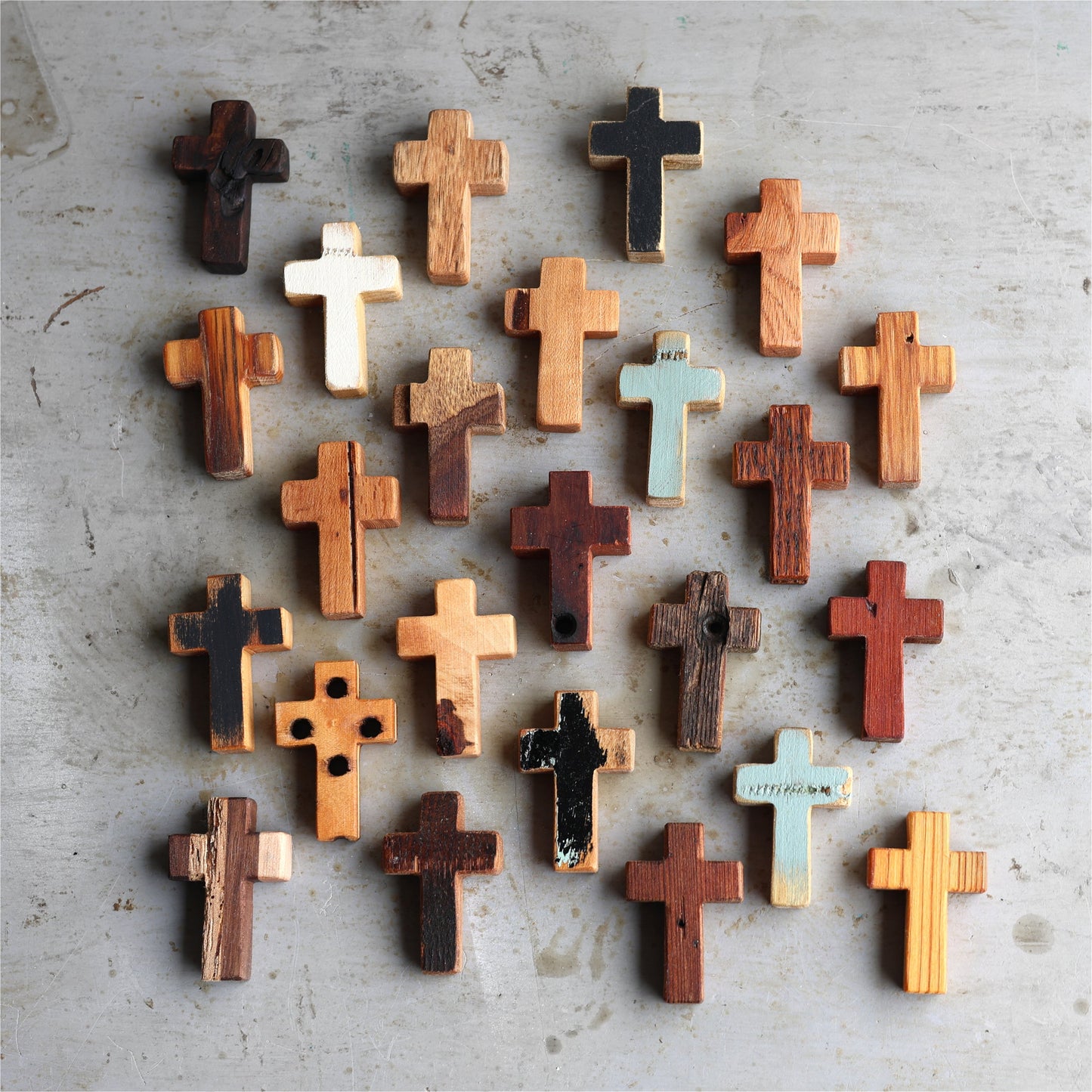 Wooden cross necklace from Dennehey Design Co. featuring a rugged pocket cross design on a metal chain.