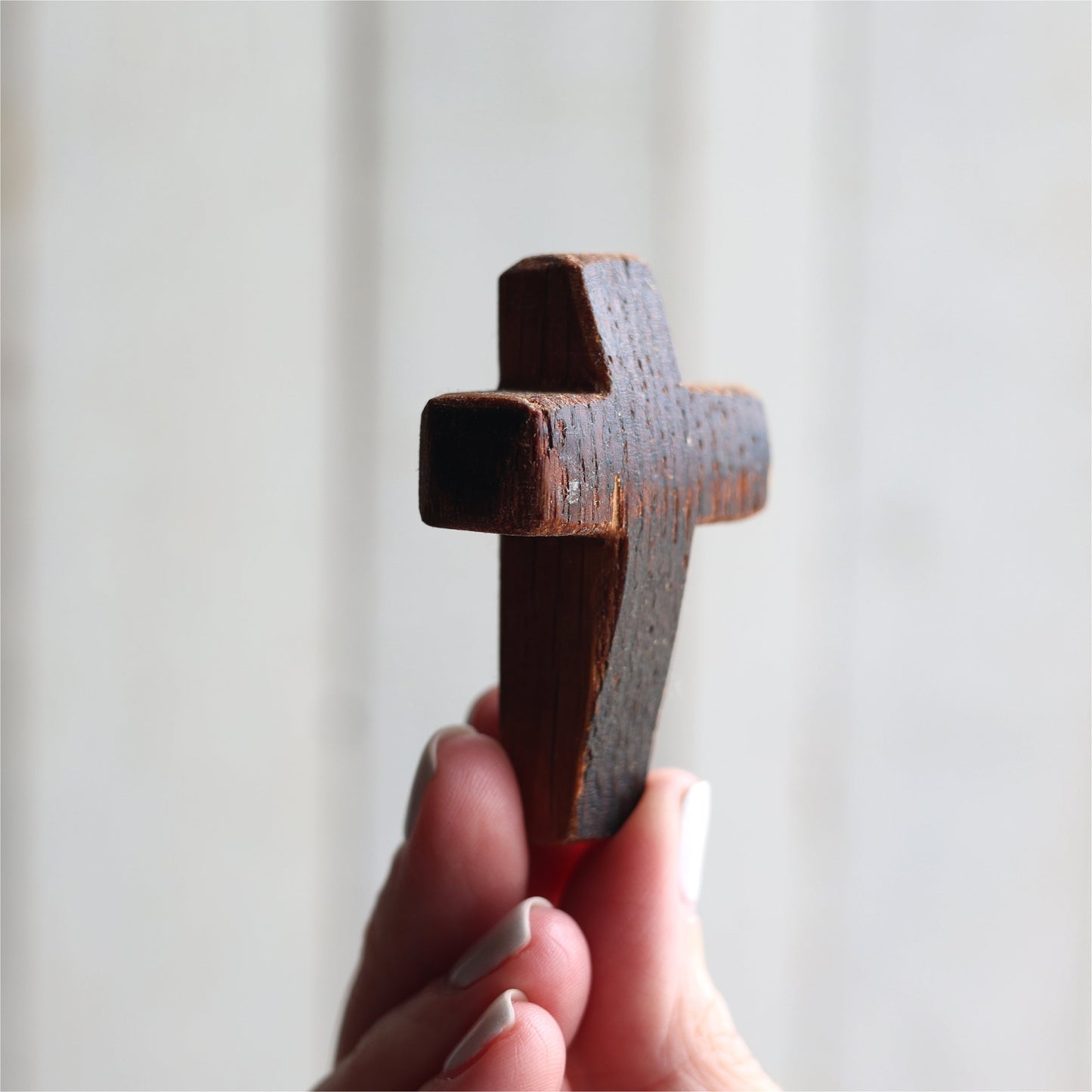 Wooden cross necklace from Dennehey Design Co. featuring a rugged pocket cross design with detailed craftsmanship.