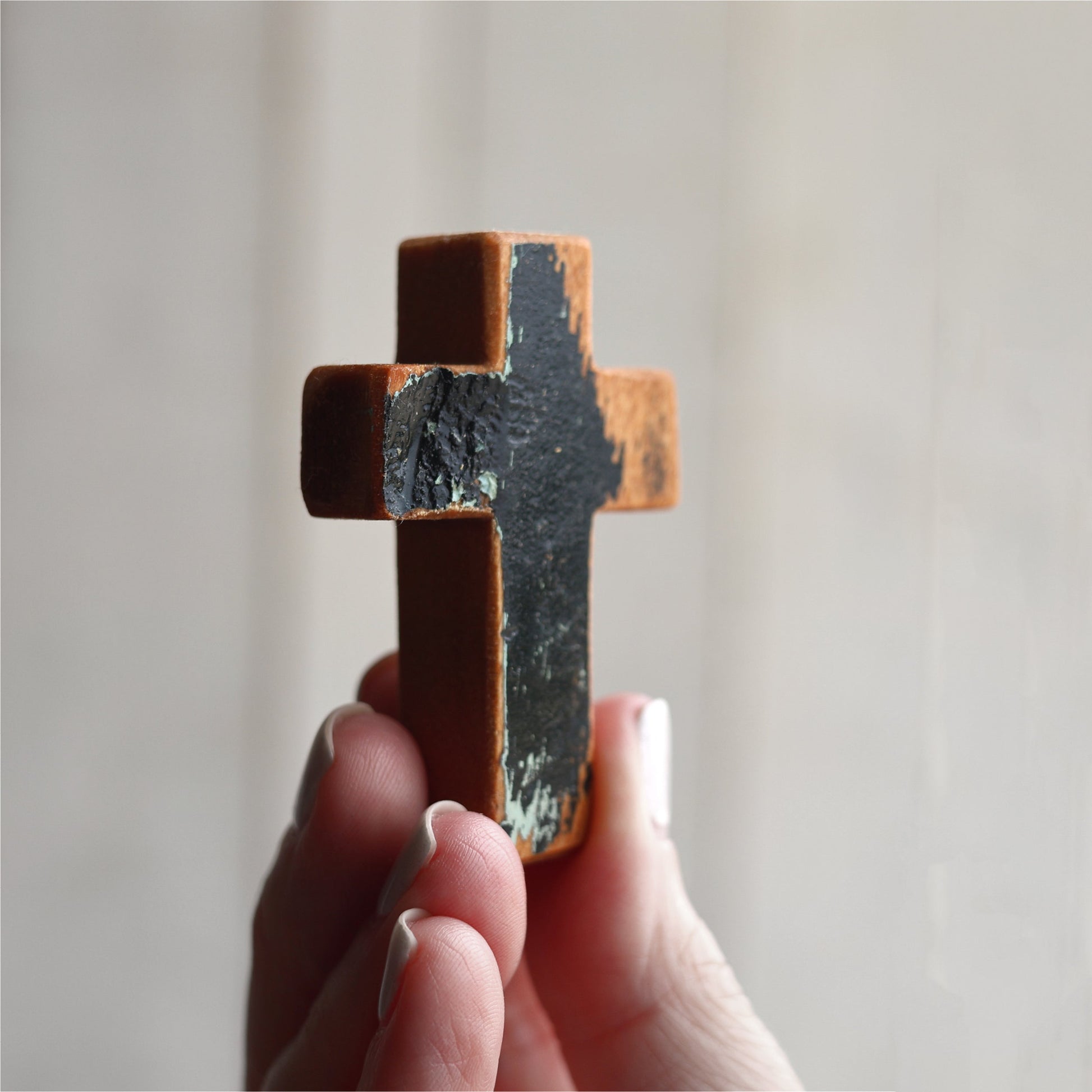 Wooden cross necklace from Dennehey Design Co. featuring a rugged pocket cross design with detailed craftsmanship.