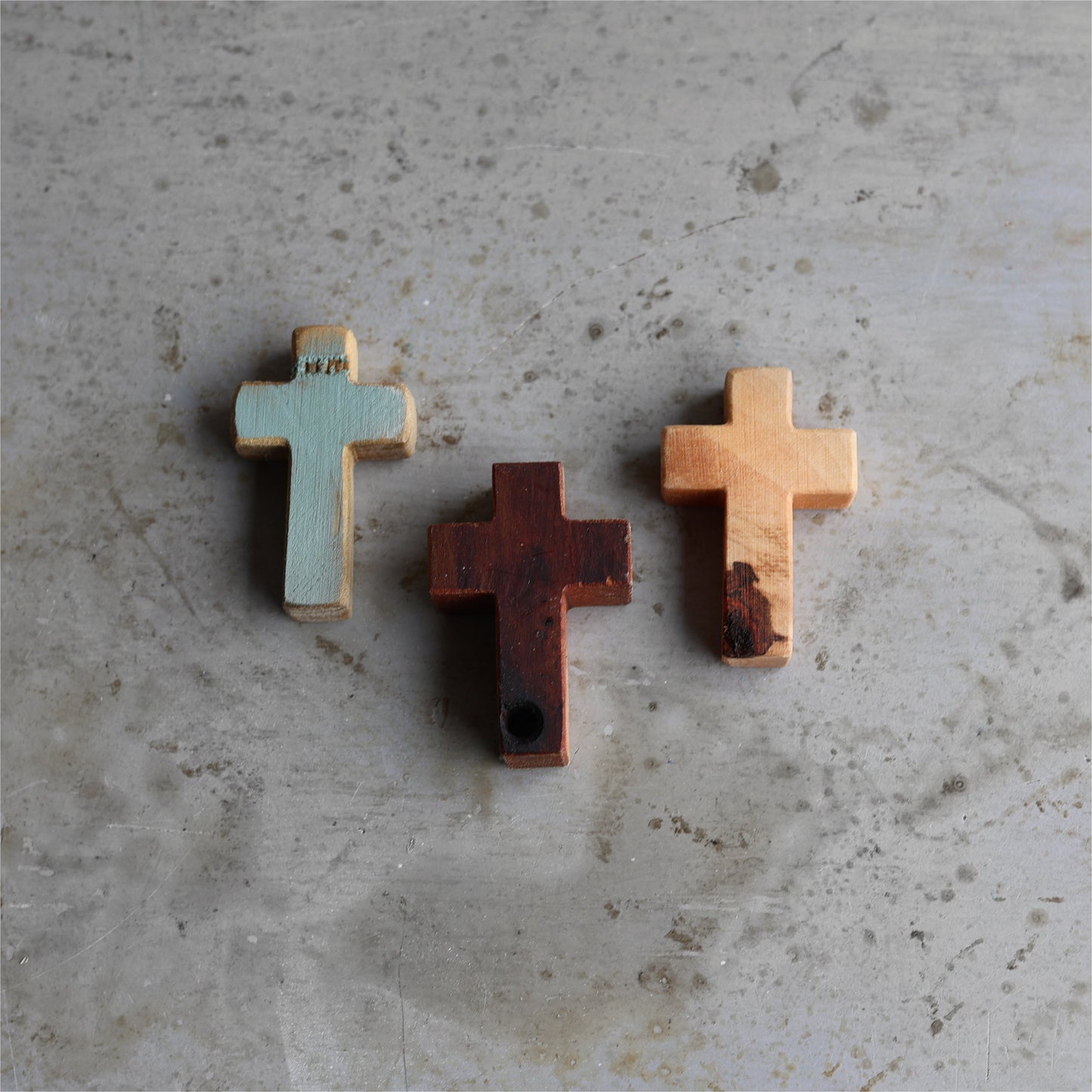 Wooden cross necklace from Dennehey Design Co., featuring a rugged pocket-style design with detailed craftsmanship.