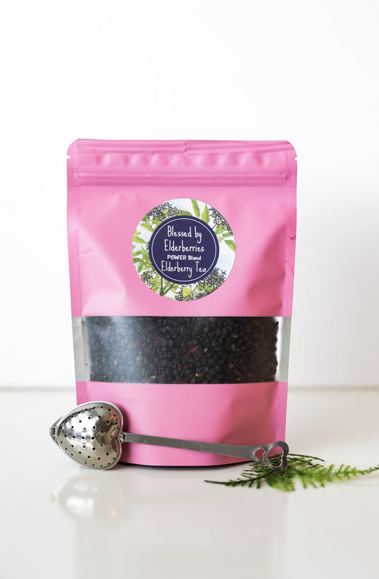 Blessed by Elderberries Power Blend Elderberry tea in a tea infusions package with dried elderberries and herbal ingredients visible.