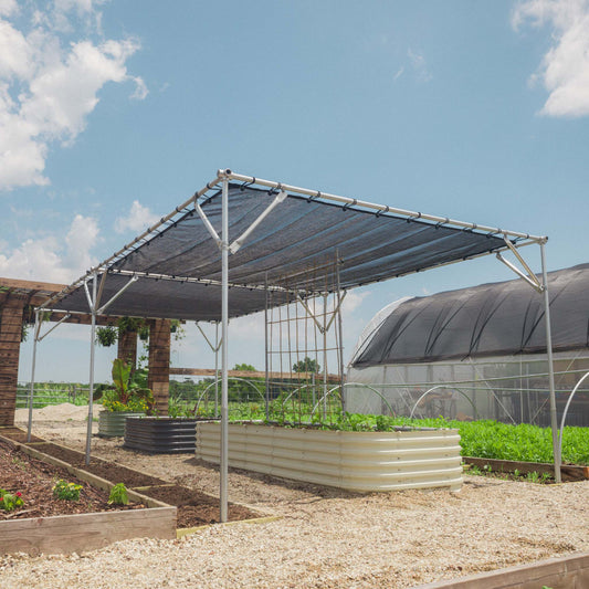 Bootstrap Farmer DIY shade structure kit assembled outdoors, showcasing a durable, customizable shade system for agricultural or garden use.