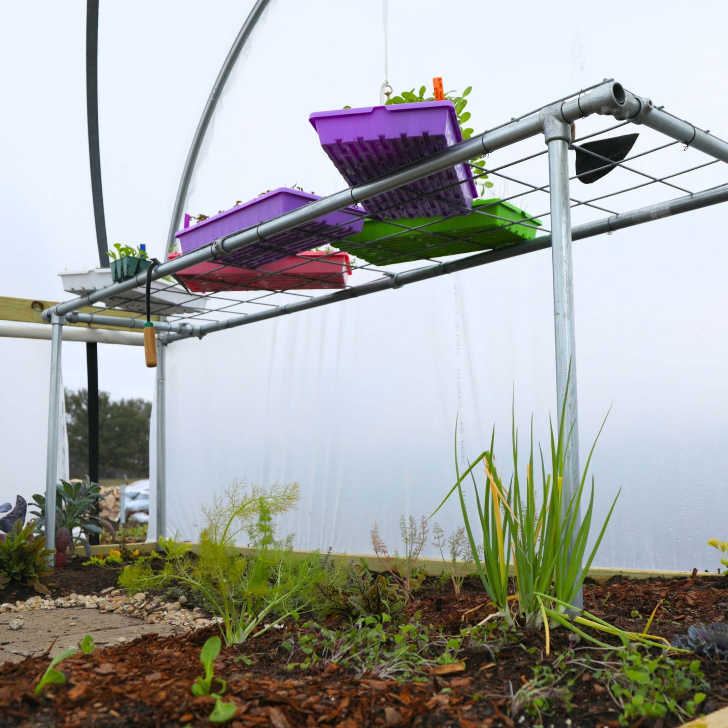 Foldable DIY potting bench by Bootstrap Farmer with work surface, storage space, and sturdy frame for gardening projects.
