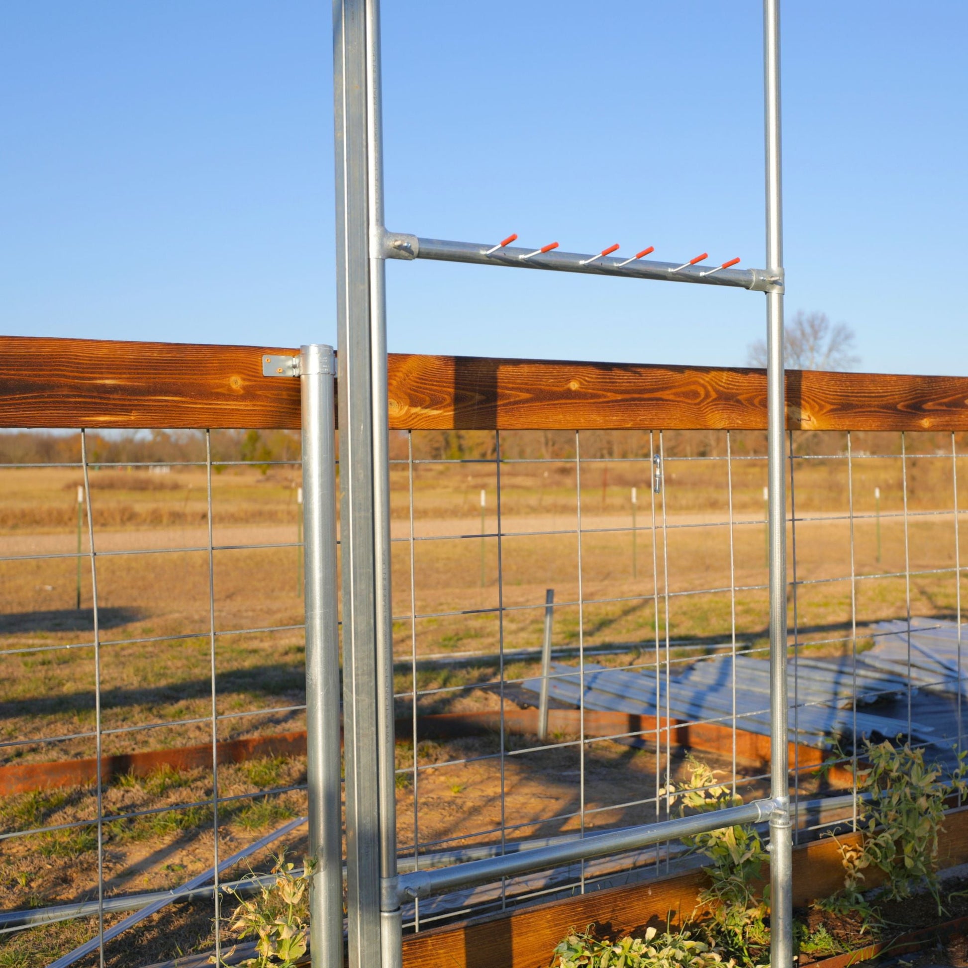 DIY garden tool organizer kit by Bootstrap Farmer for 1 ⅜-inch fence rail pipe, showing a practical tool storage setup.