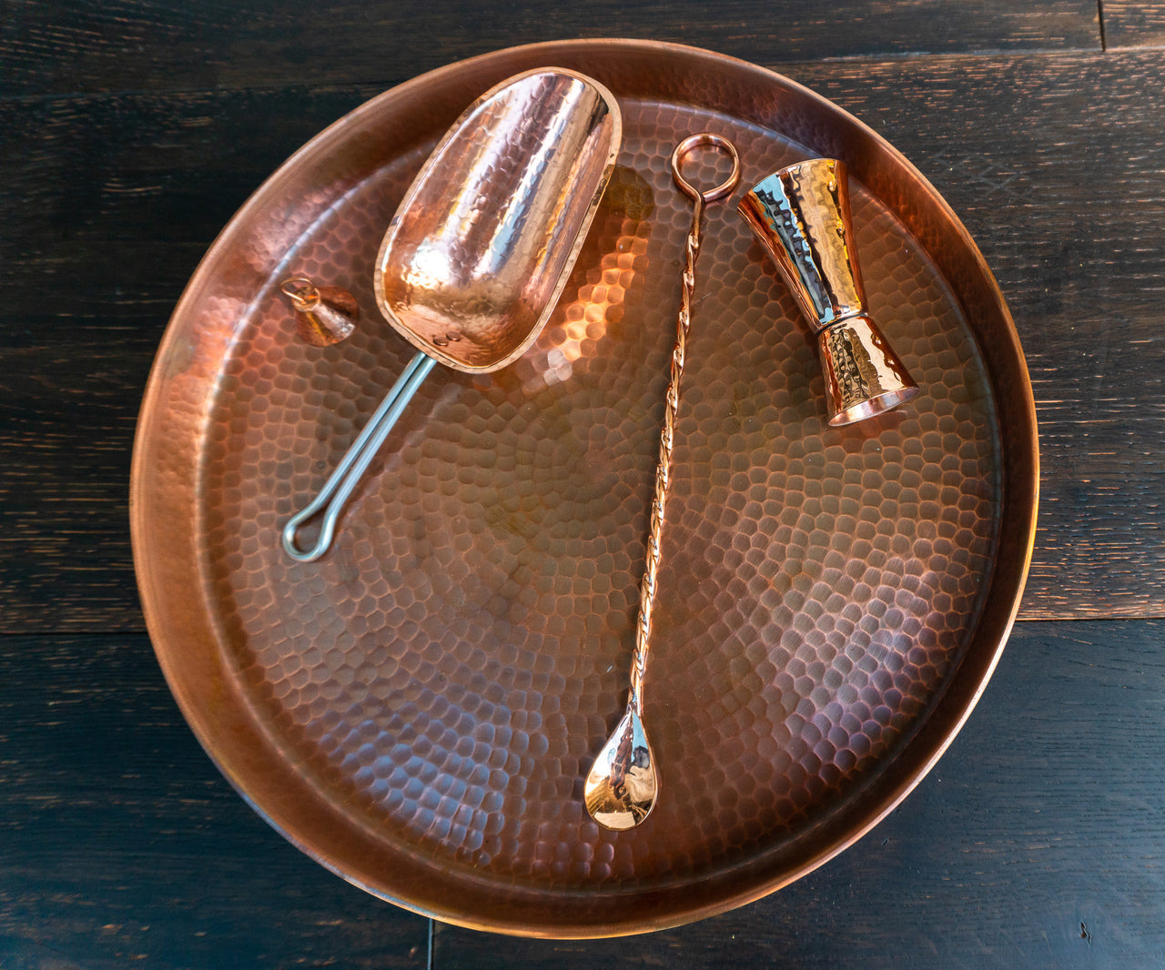 Copper oyster serving tray by Sertodo, featuring a round design with multiple compartments for serving oysters and barware.
