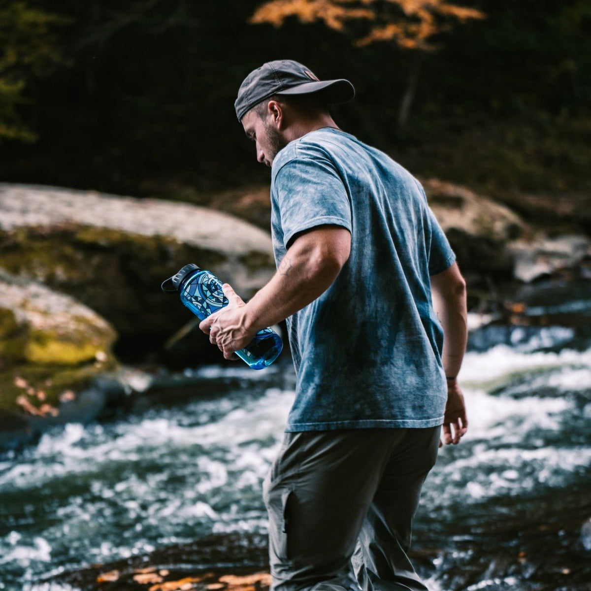 Epic Water Filters Everywhere Bottle filter with casing, showcasing the portable water filtration system and its durable casing.