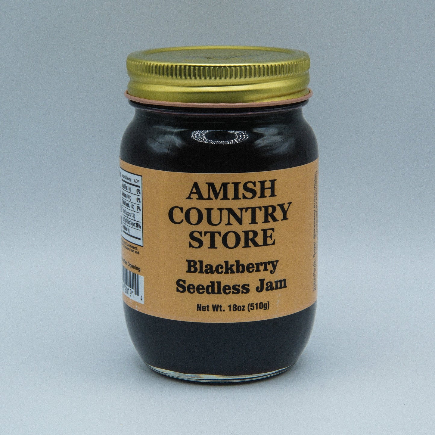 Cans of Amish Country Store Blackberry Seedless Jam in 18 oz jars, featuring a label with fresh blackberries and product details.
