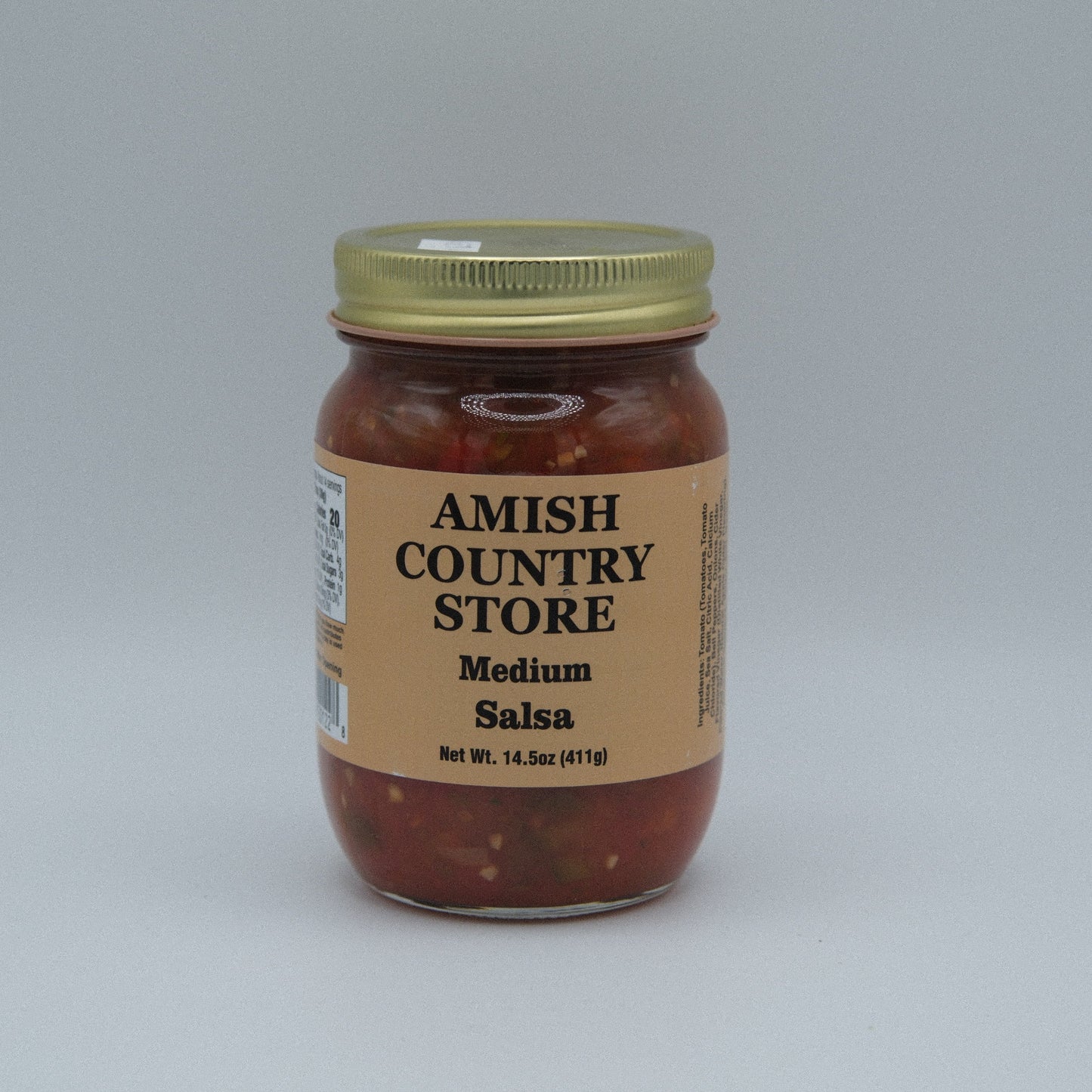 Canned medium salsa jar from Amish Country Store, 14.5 oz, with fresh tomatoes, peppers, and herbs visible on the label.