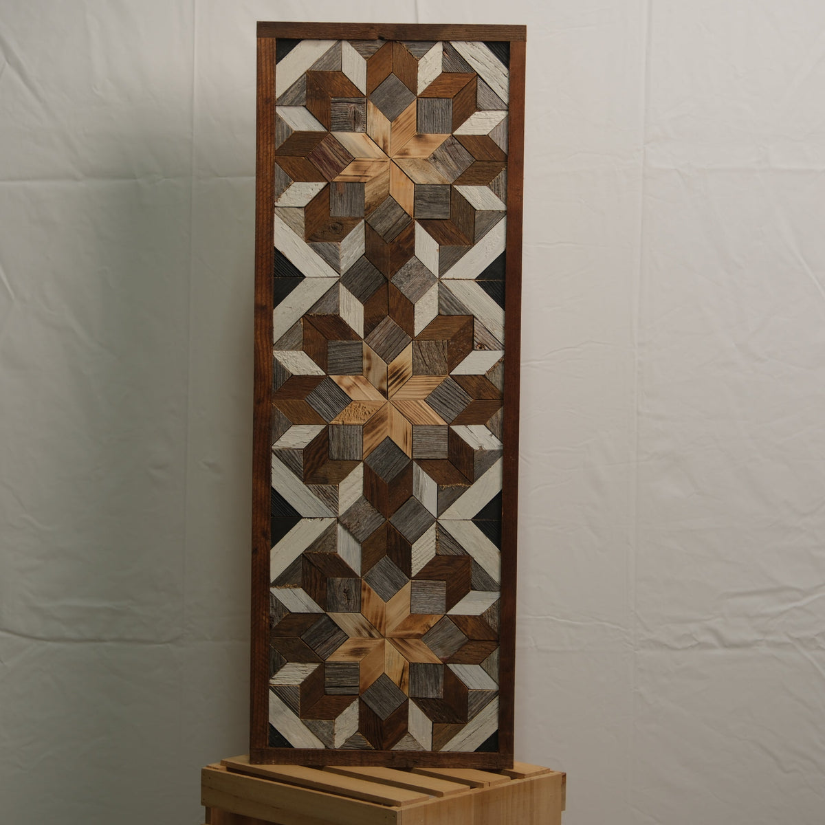 Amish handmade barn quilt banner, 10.5 x 30 inches, featuring traditional geometric patterns, displayed outdoors.