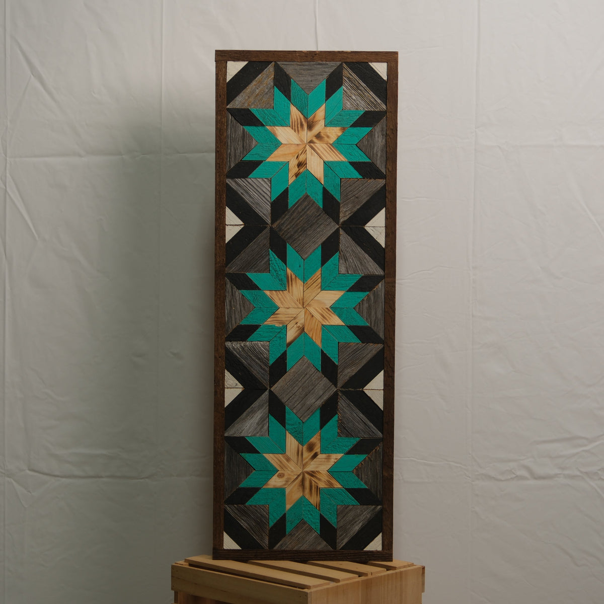 Amish Handmade Barn Quilt banner with traditional geometric pattern, measuring 10.5 by 30 inches, displayed on a wooden fence.
