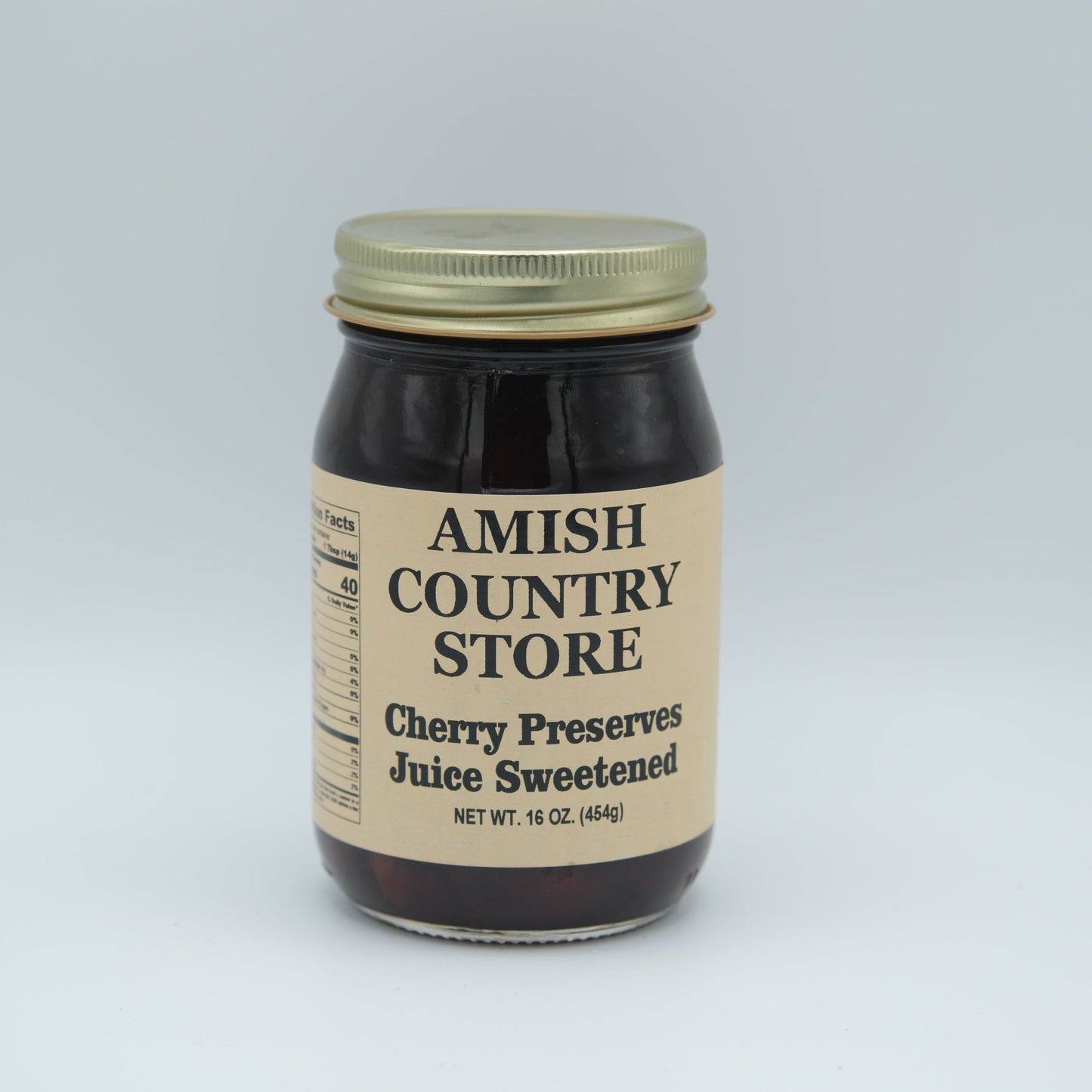 Canned Amish Country Store cherry preserve juice in a 16 oz jar, sweetened and ready to enjoy.