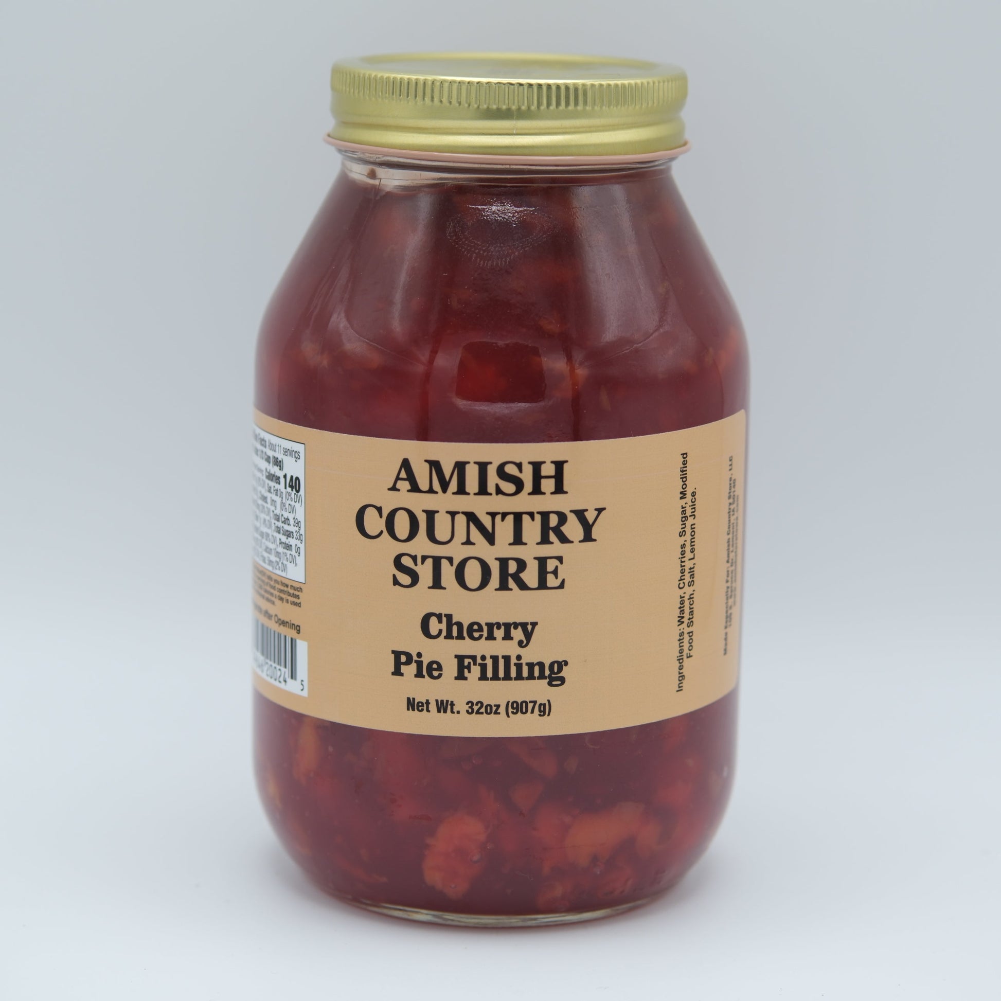 Sweet Amish Country Store cherry pie filling in a jar, with visible cherries and syrup, ready for baking or dessert.