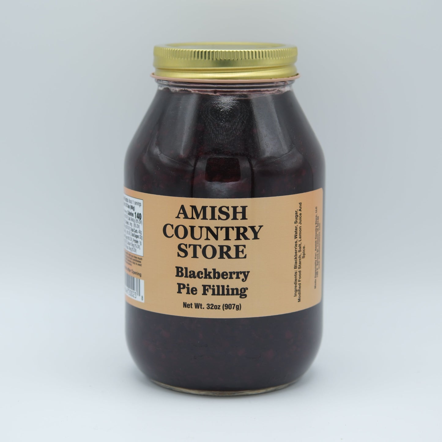 Amish Country Store Blackberry Pie Filling jar with label, showing rich dark blackberries and fruit filling inside.