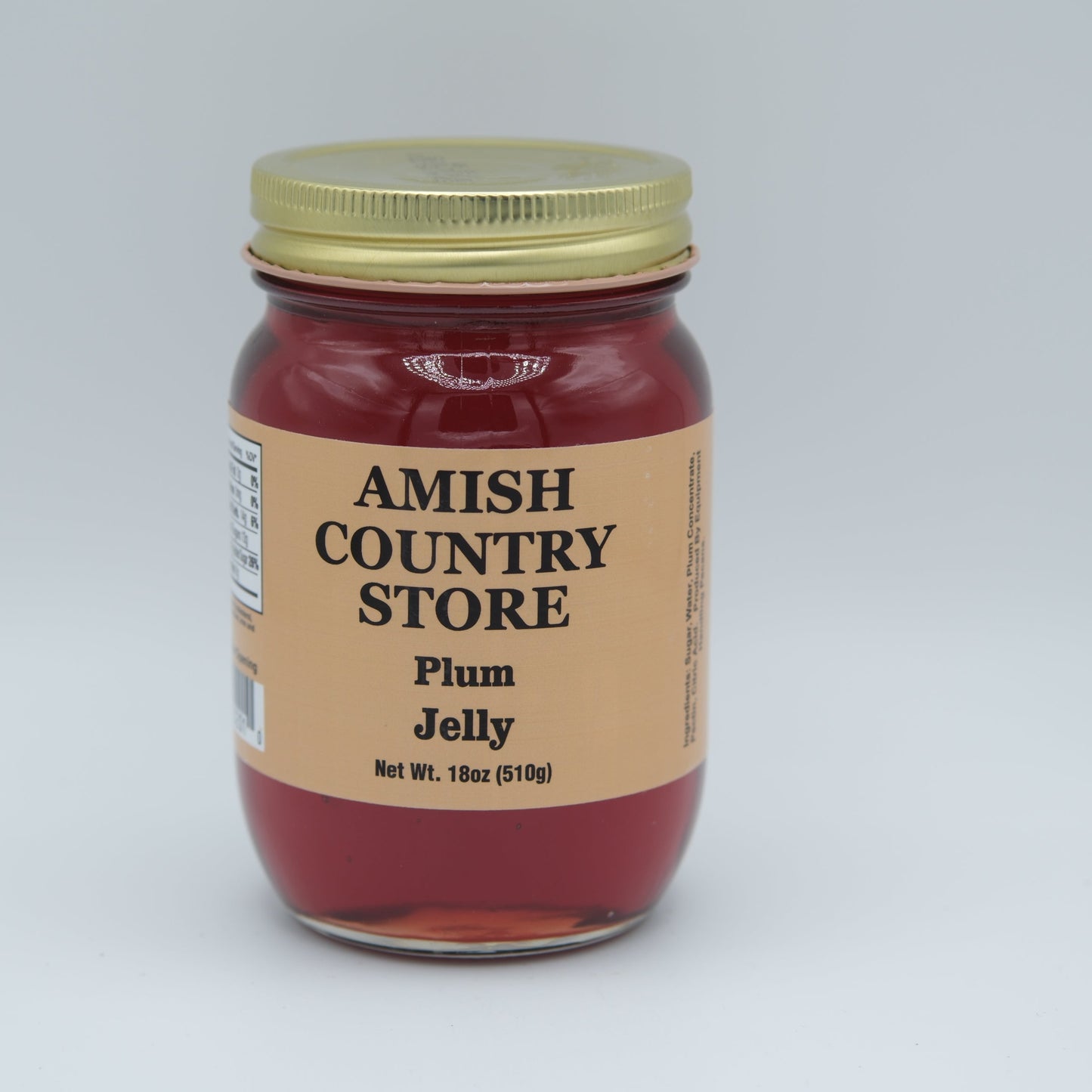 Amish Country Store plum jelly in a 18oz can, smooth purple jam with a glossy surface, ideal for spreading or pairing with foods.