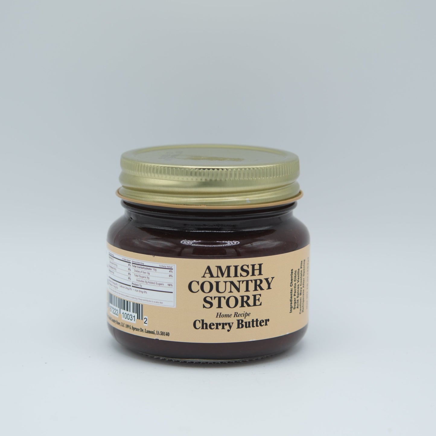Canned cherry butter in a 16 oz jar from Amish Country Store, smooth spread with vibrant red cherries visible inside.