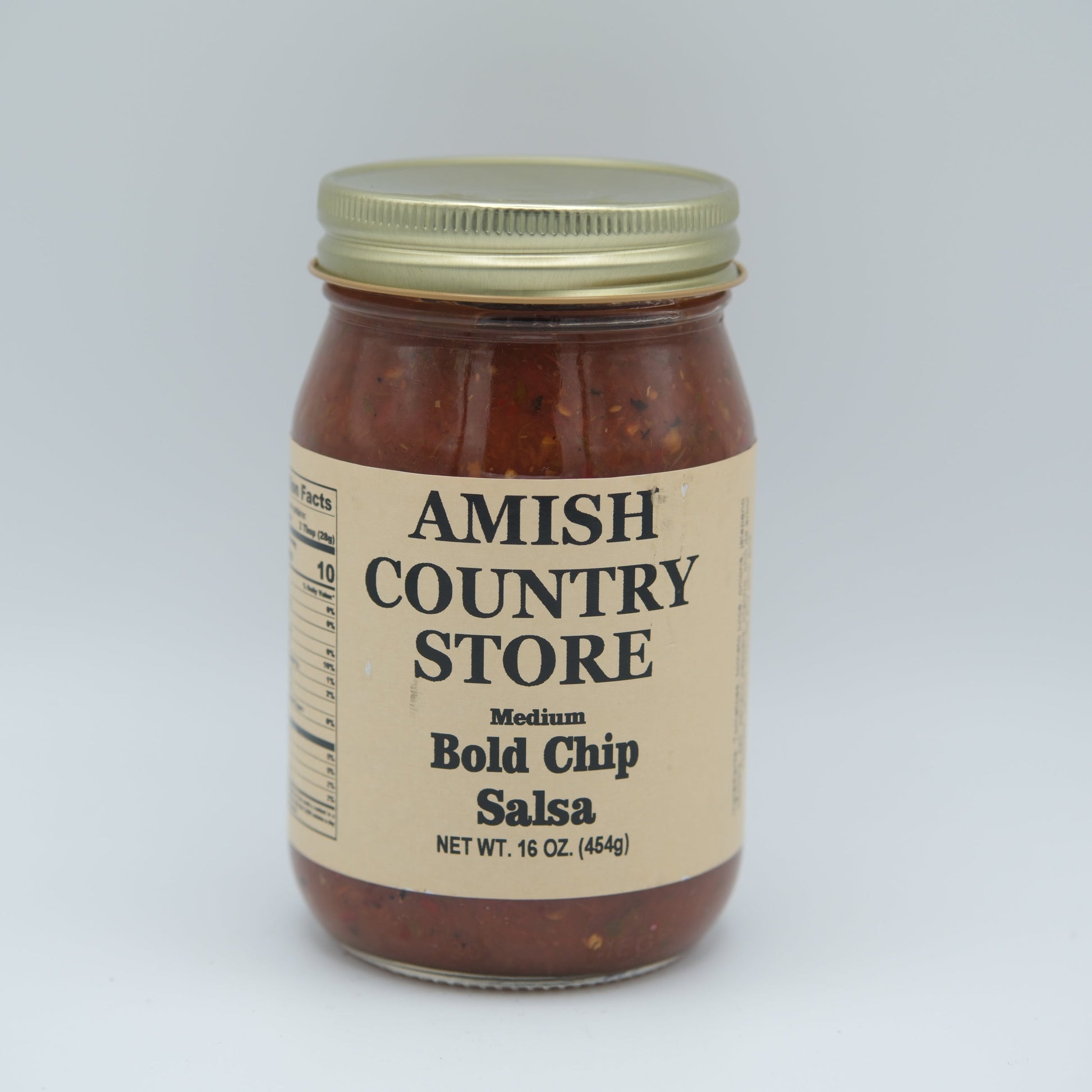 Canned Bold Chip Salsa 16 oz by Amish Country Store, showing a jar of spicy tomato salsa with fresh ingredients.
