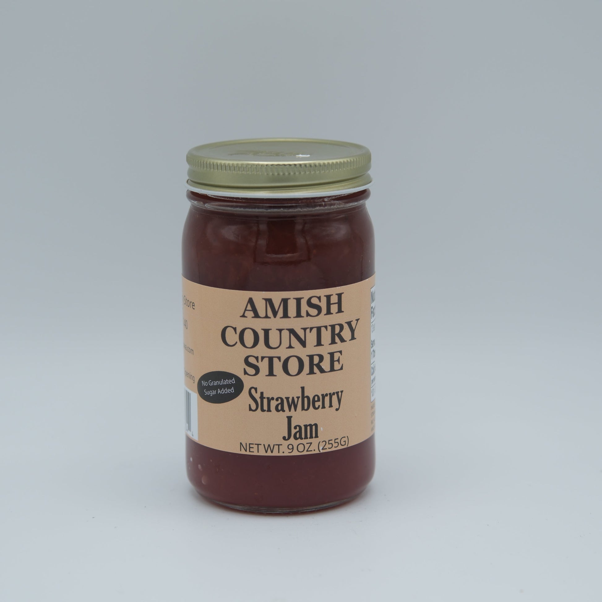 Amish Country Store no sugar added strawberry jam in 8 oz canned jar, showcasing fresh, ripe strawberries and jam texture.