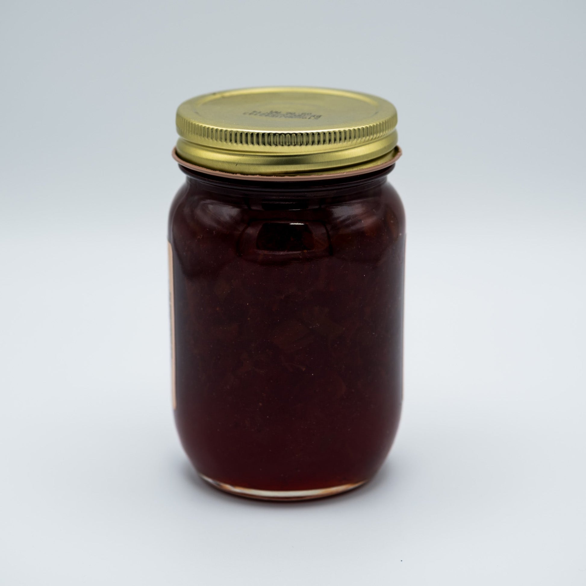 Amish Country Store strawberry rhubarb jam jar, 18 oz canned goods, with a label showing fresh strawberries and rhubarb.