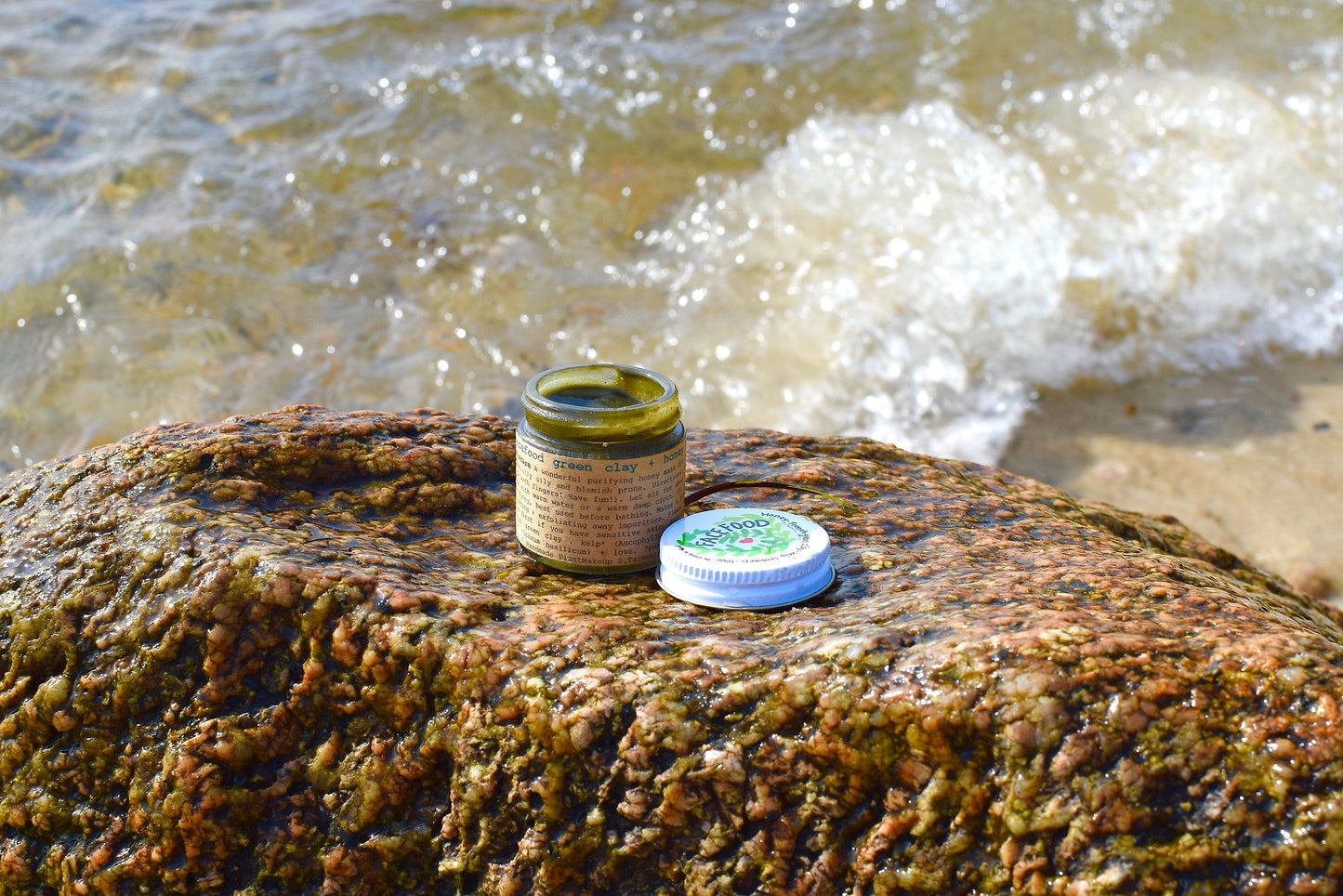 Close-up of a Facefood skin care product by plant makeup, featuring natural ingredients in a sleek container.