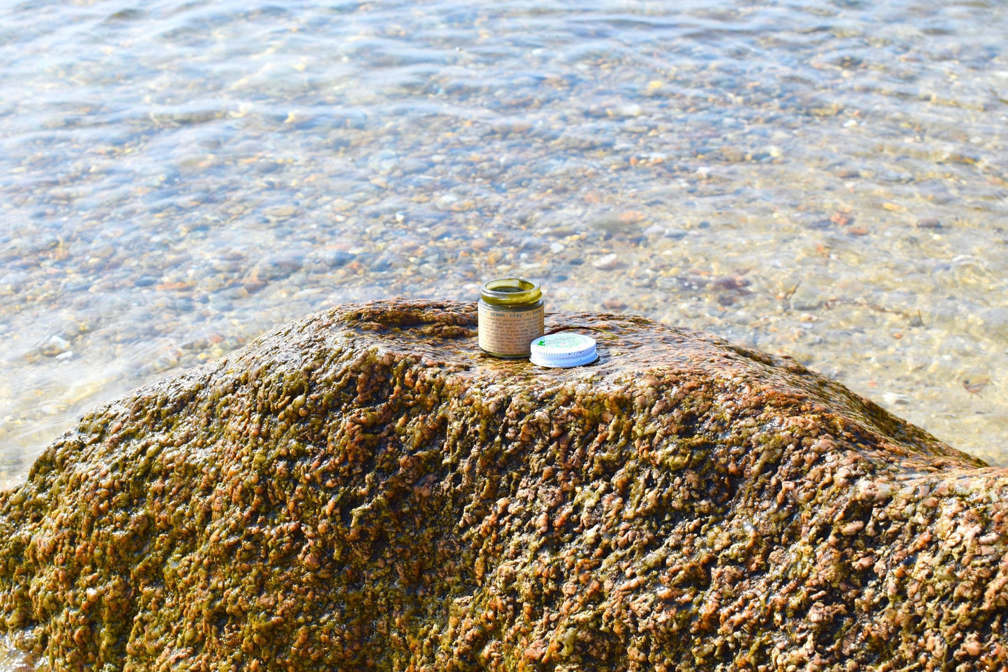 Close-up of plant makeup Facefood skincare product with natural green packaging and product details visible.