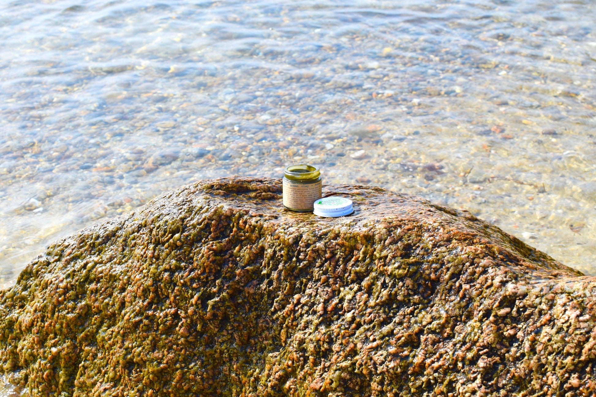 Close-up of plant makeup Facefood skincare product with natural green packaging and product details visible.