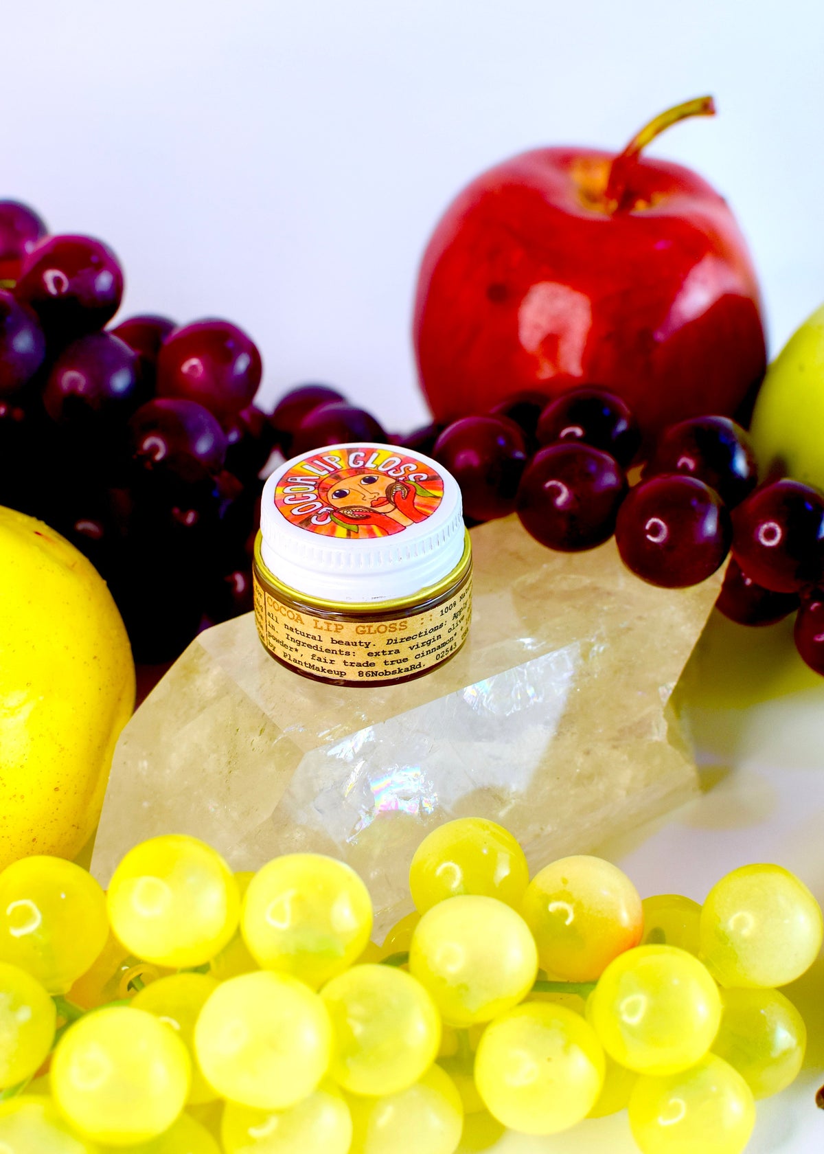 Plant Makeup Cocoa Lip Gloss tube with glossy, smooth finish, showcasing the natural, nourishing lip gloss product.
