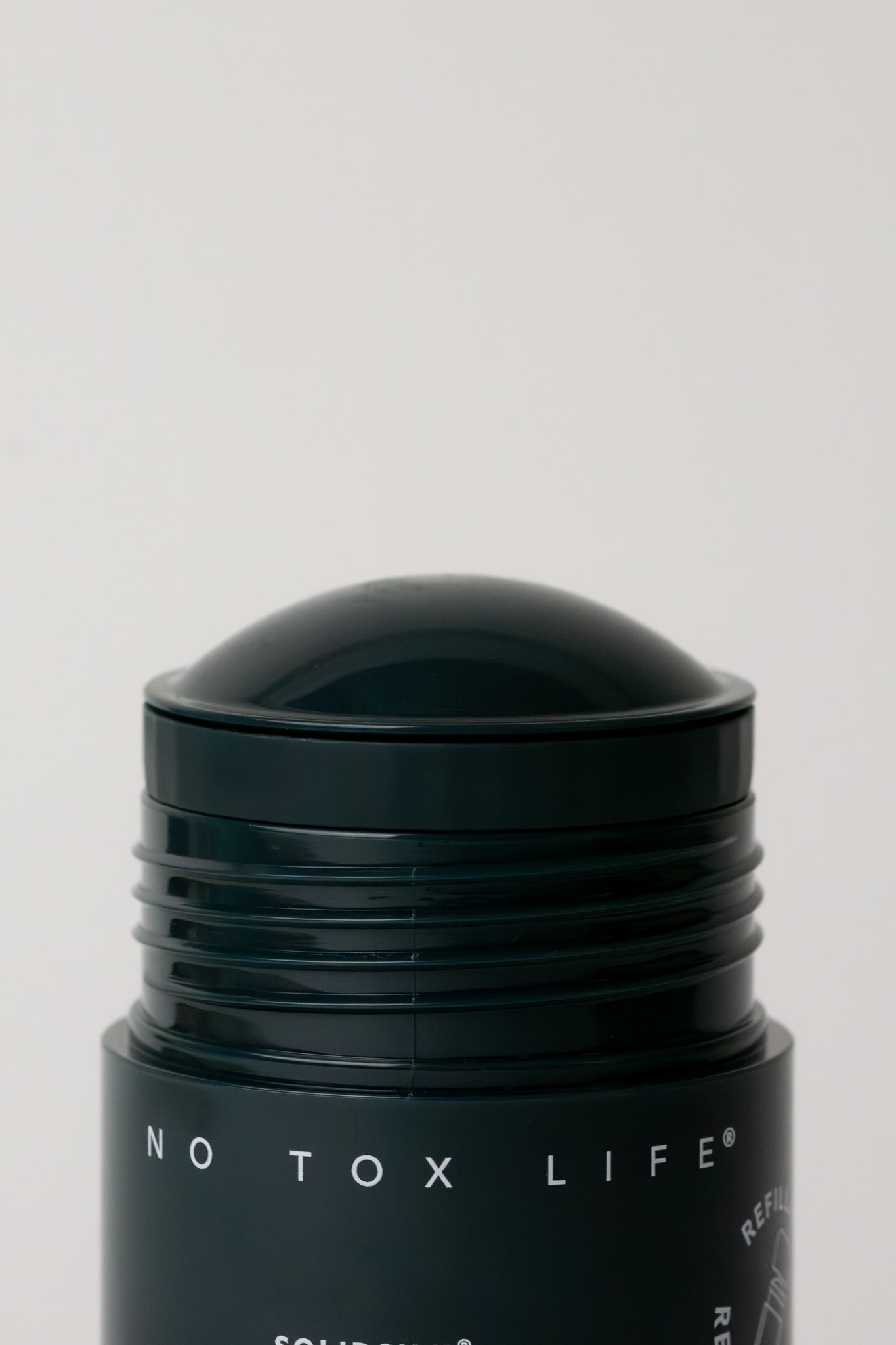 No Tox Life SOLIDSILK Refillable Deodorant in Earl Grey, extra strength, with natural packaging and product label visible.