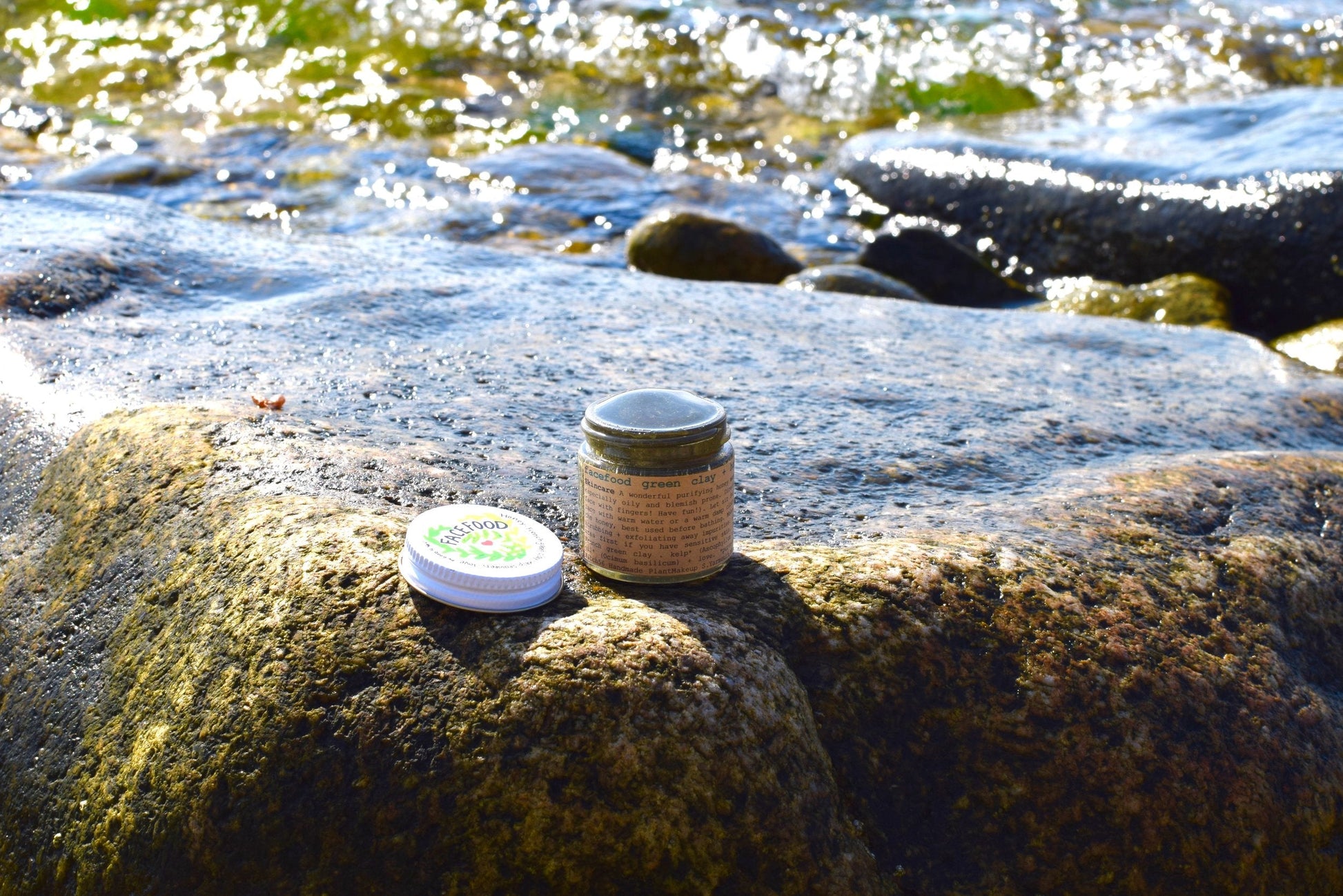 Close-up of a skincare product bottle labeled Facefood by plant makeup, showcasing its natural, eco-friendly packaging.