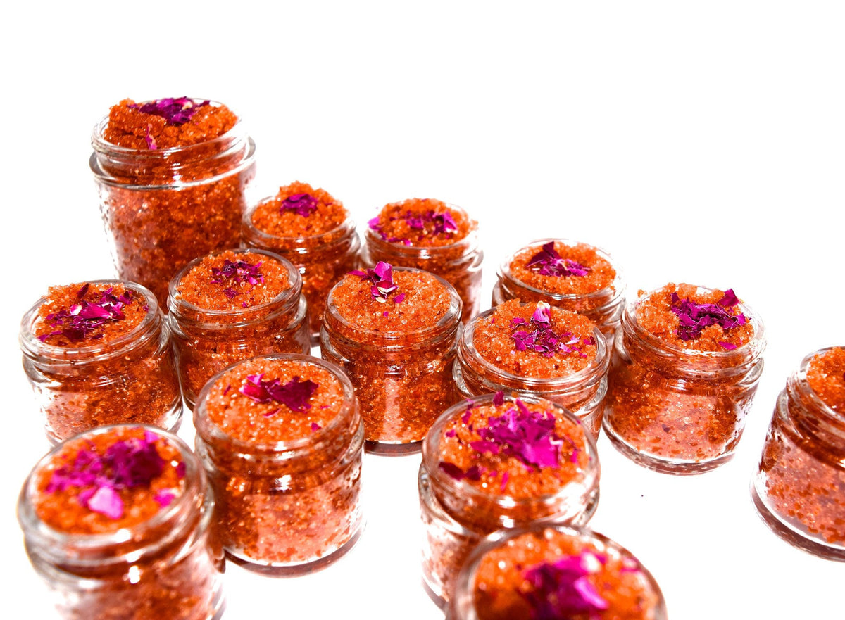 Plant Makeup Beach Rose Scrub jar with pink rose petals and natural ingredients, close-up of the product container and textured scrub.