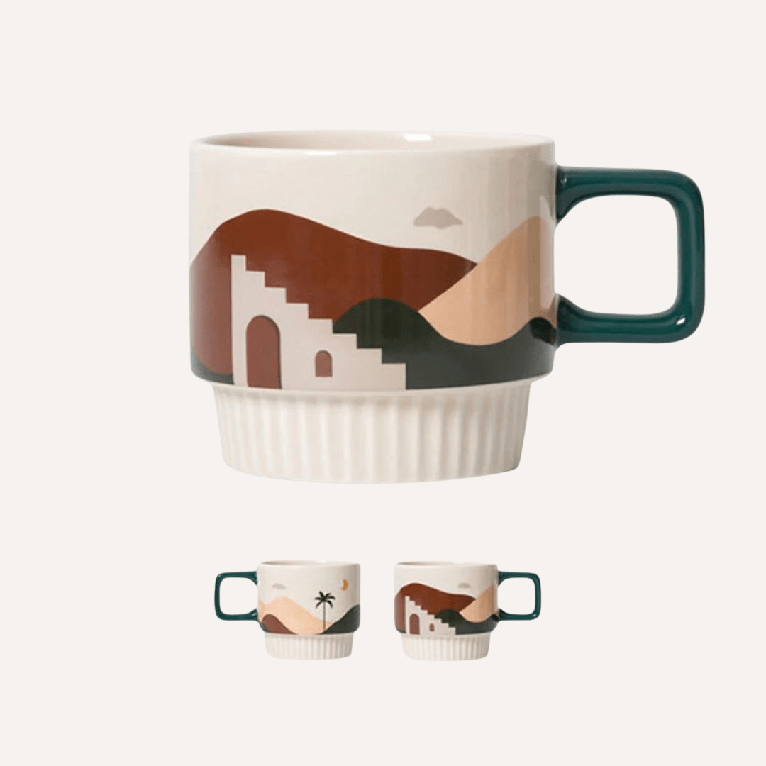 Handcrafted ceramic Desert Vibe artisanal mug with a tan background, featuring a desert-inspired design by Tilley + Me.