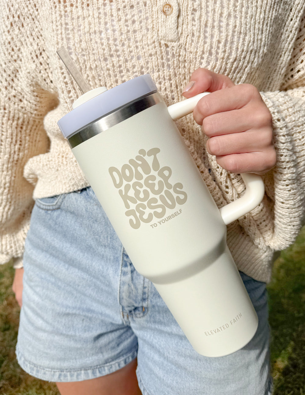 40 oz tumbler by Elevated Faith with "Don't Keep Jesus to Yourself" slogan, featuring a colorful design and durable stainless steel construction.