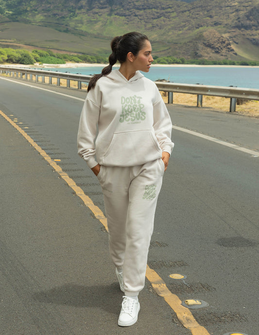 Unisex hoodie by Elevated Faith with "Don't Keep Jesus to Yourself" printed design on front, casual fit and soft fabric.